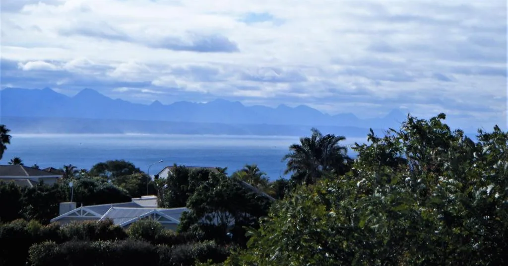 Panoramic ocean and mountain vista from property overlooking Plettenberg Bay