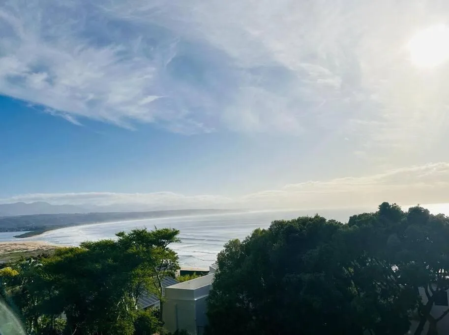 Expansive lagoon and mountain vista from elevated property vantage point