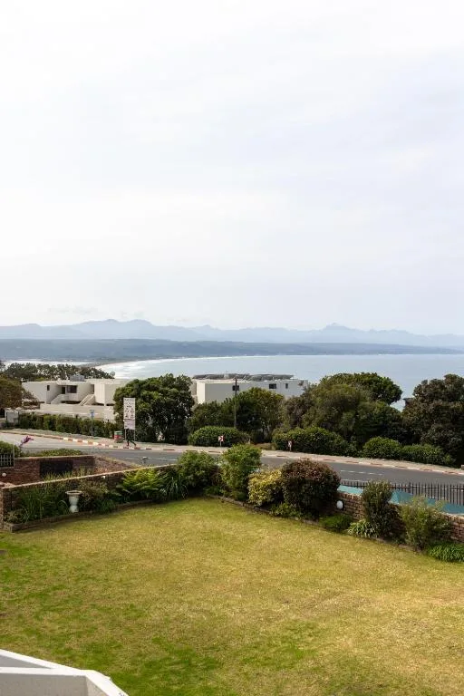 Lagoon and mountain vista from property overlooking lush gardens