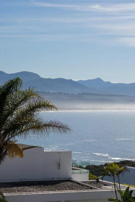 Panoramic ocean and mountain vista from property overlooking Plettenberg Bay coastline