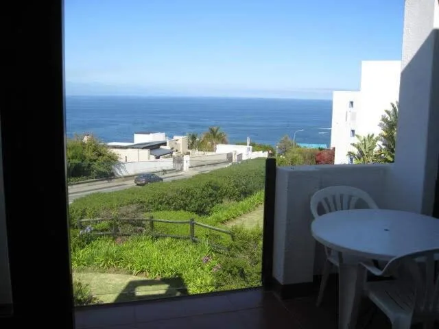 Ocean view from private deck with garden and coastal landscape visible