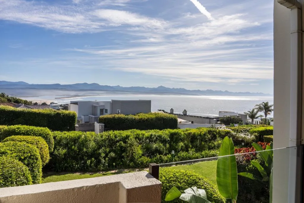 Expansive ocean and mountain vista from property overlooking Plettenberg Bay