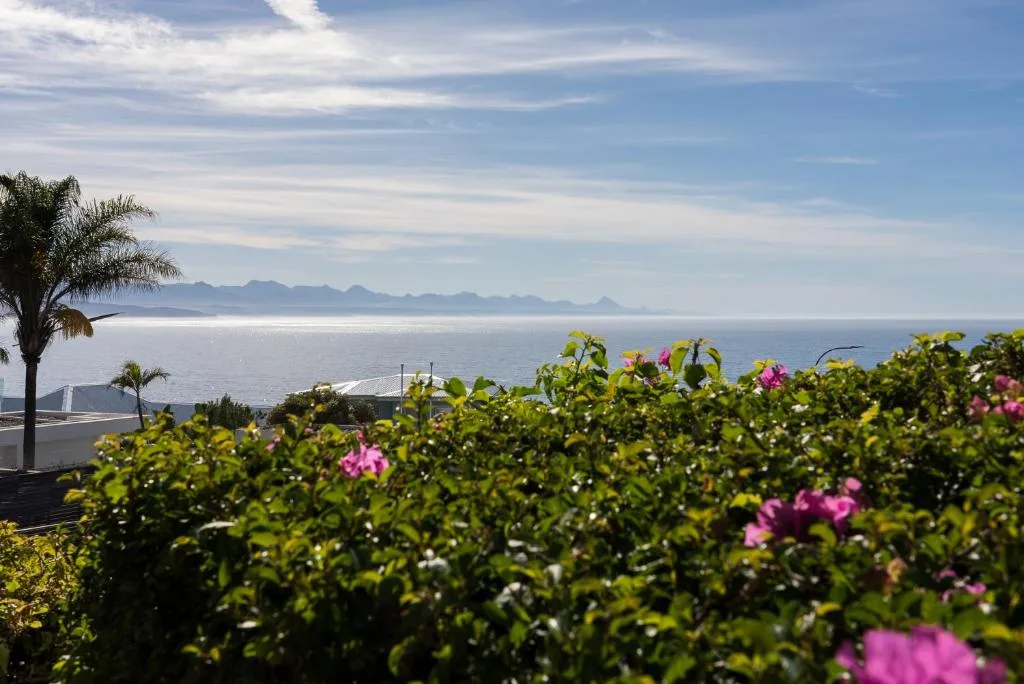Ocean view with distant mountains across Plettenberg Bay lagoon