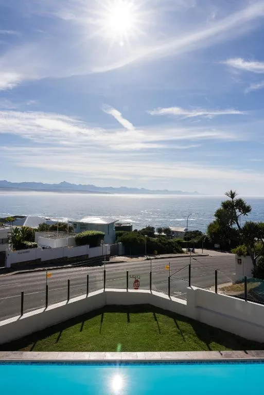 Panoramic ocean and mountain vista from elevated property overlooking Plettenberg Bay