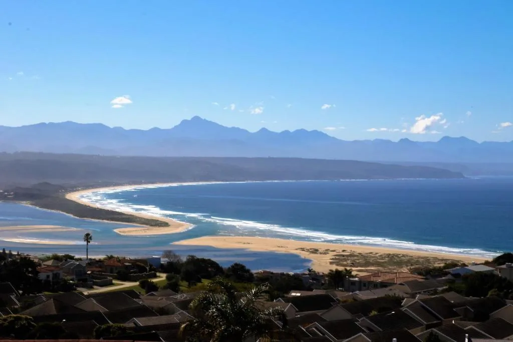 Stunning coastal vista of Plettenberg Bay with golden beaches and mountains
