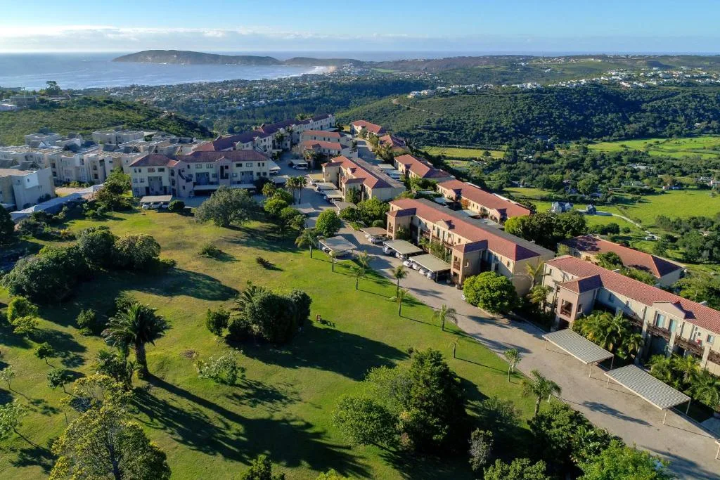 Aerial view of property complex overlooking Plettenberg Bay and surrounding landscape