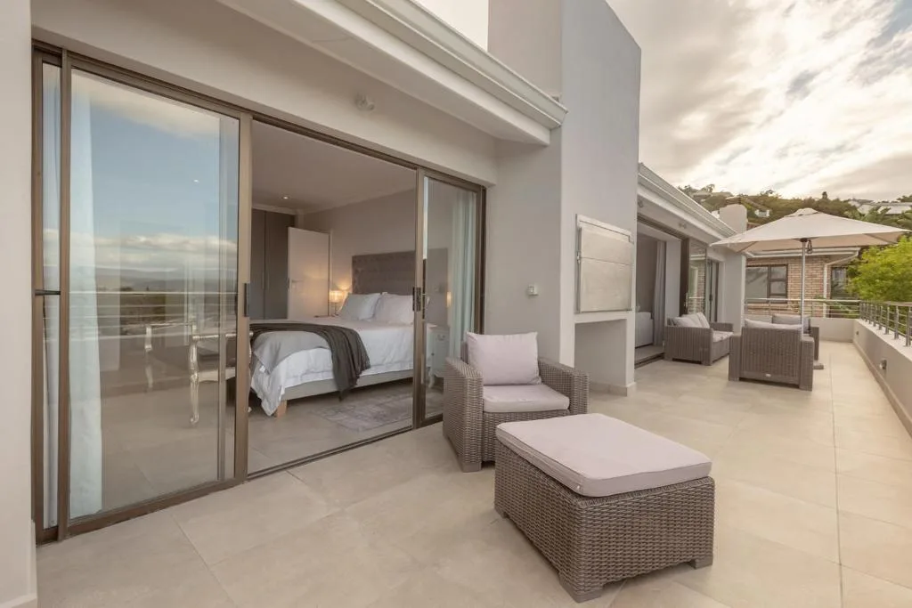 Spacious outdoor patio with comfortable seating and mountain views