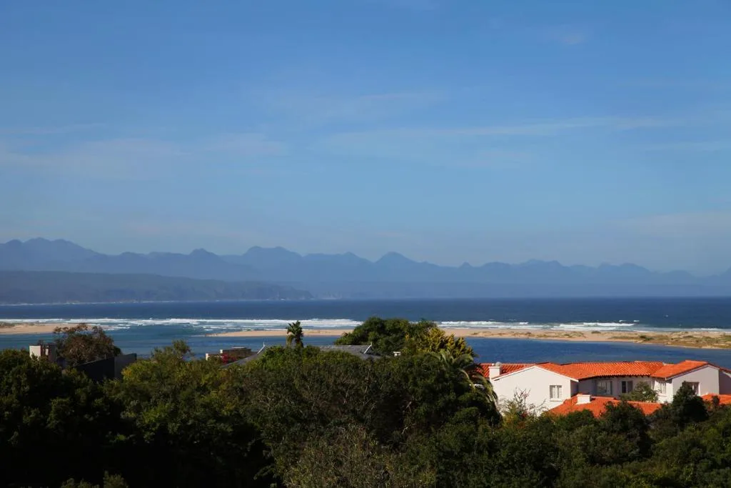 Panoramic coastal view of Plettenberg Bay with mountains and ocean
