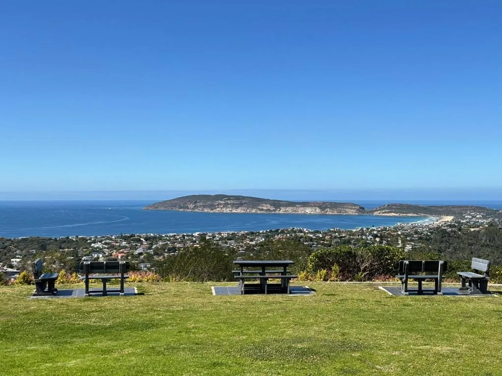 Panoramic coastal vista of Plettenberg Bay with islands and scattered homes