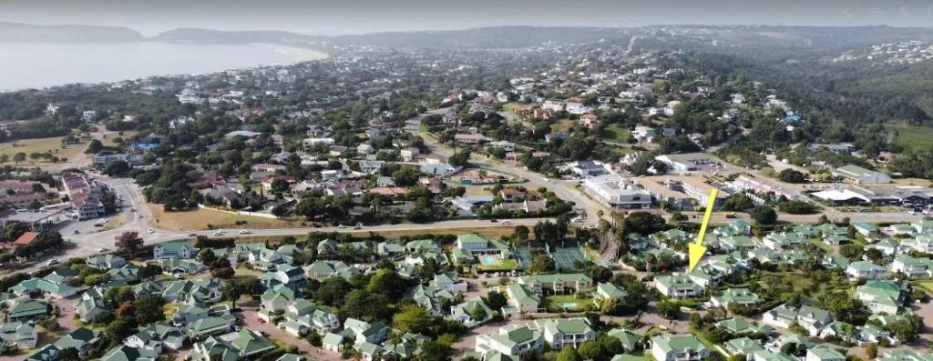 Aerial view of Plettenberg Bay coastal town and surrounding green landscape