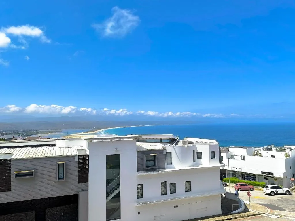 Expansive ocean and coastline vista from elevated property viewpoint