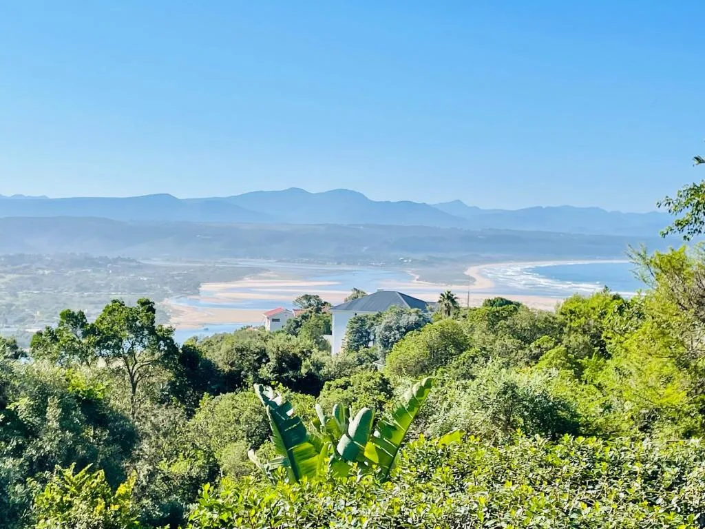 Scenic coastal vista overlooking Plettenberg Bay beach and mountains