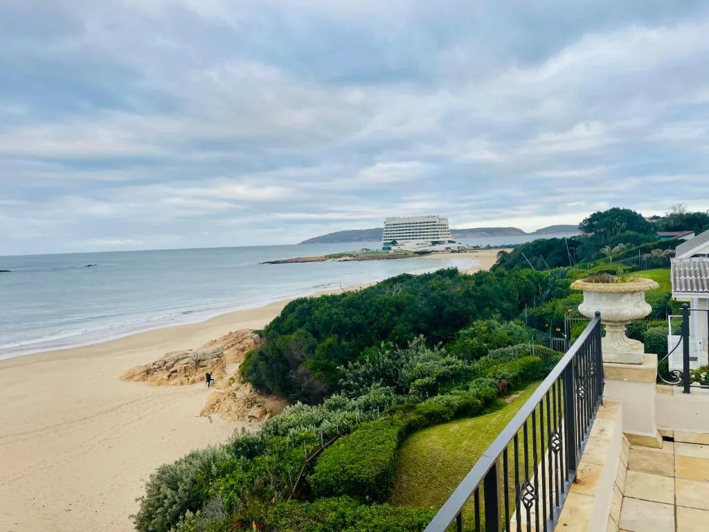 Scenic beach and ocean vista from elevated property overlooking sandy shore
