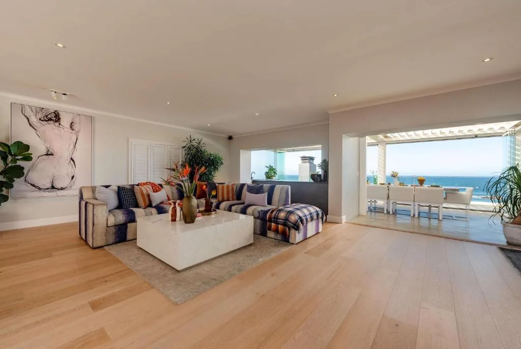 Spacious modern lounge with ocean views through sliding glass doors