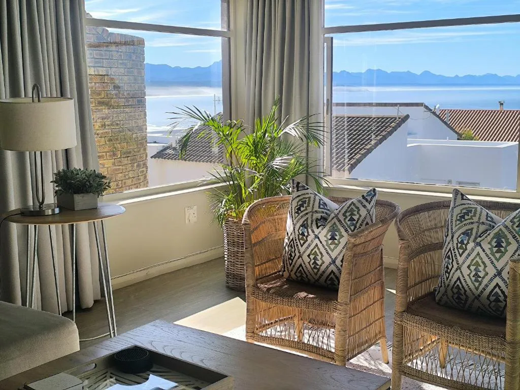 Sweeping lagoon and mountain views from comfortable lounge seating area