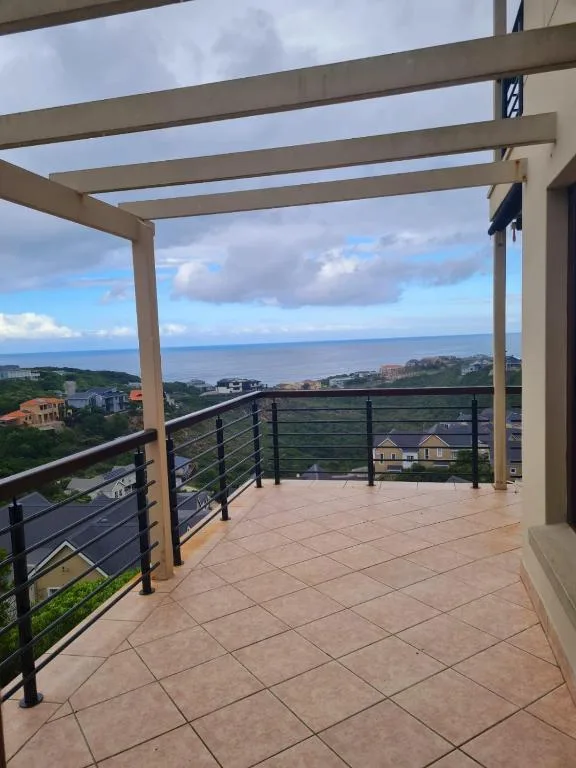 Covered patio with ocean and coastal village views from pergola