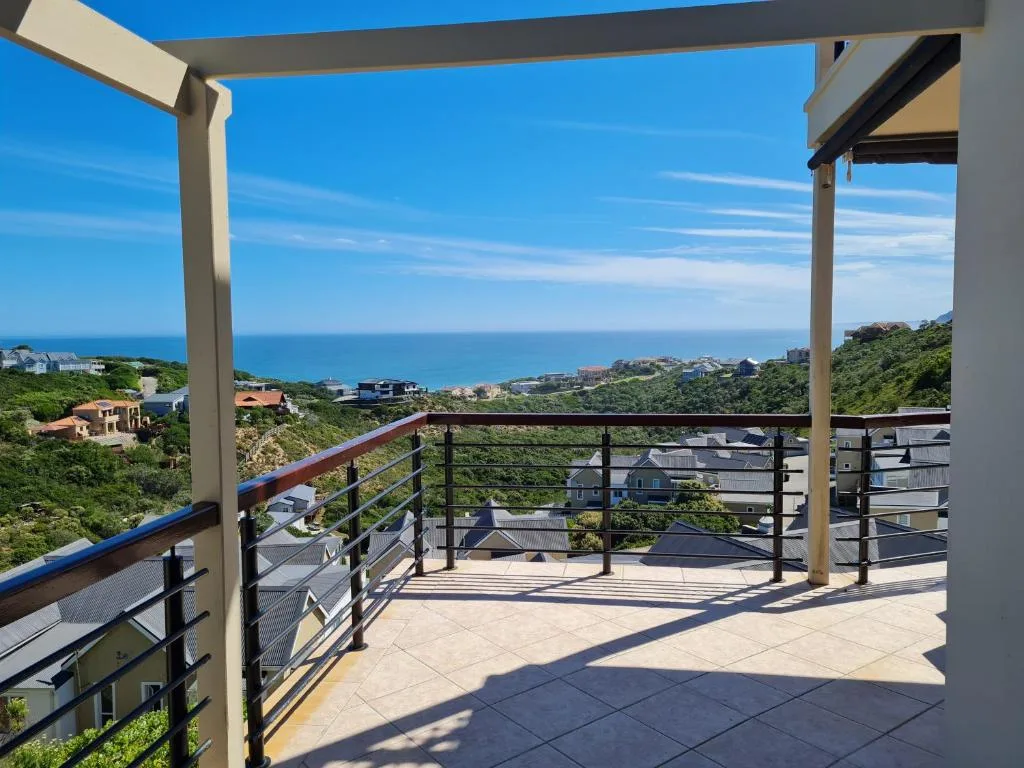 Spacious covered deck with ocean and coastal town views