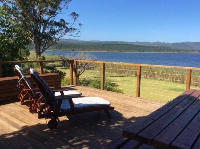 Lakeside deck with mountain views across Swartvlei Lake
