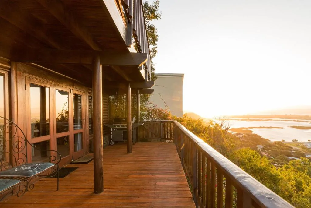Wooden deck with lagoon and sunset views from the property