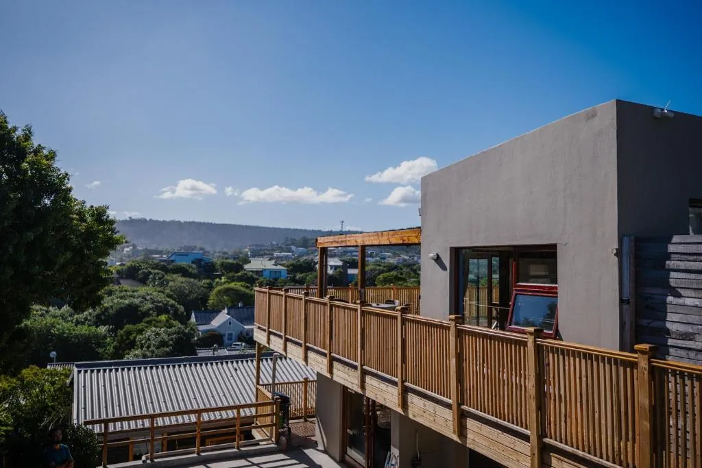 Expansive landscape view of hills and valley from elevated wooden deck