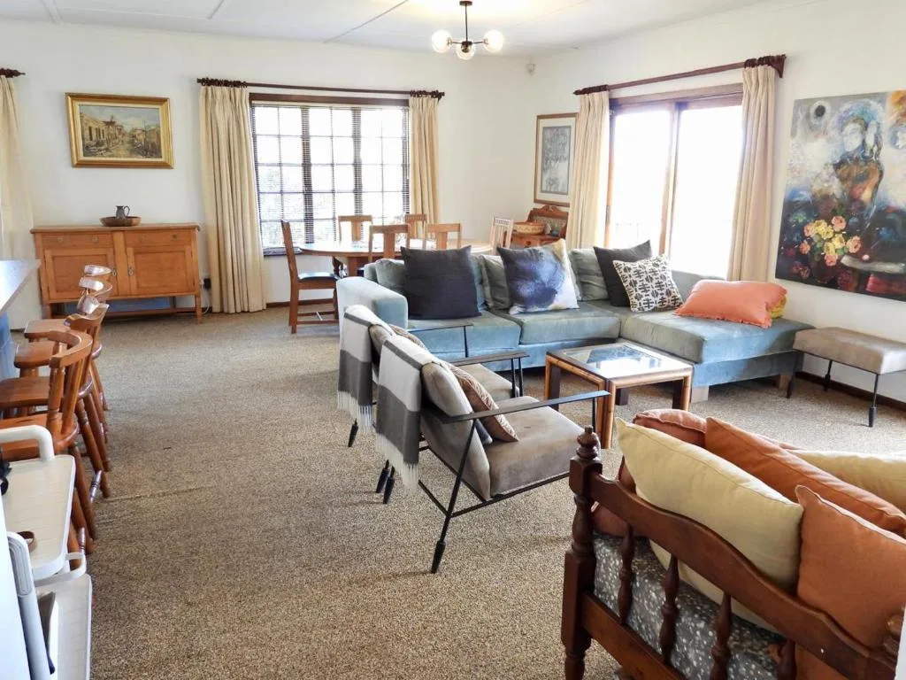 Spacious living room with sectional sofa, comfortable seating, and natural light