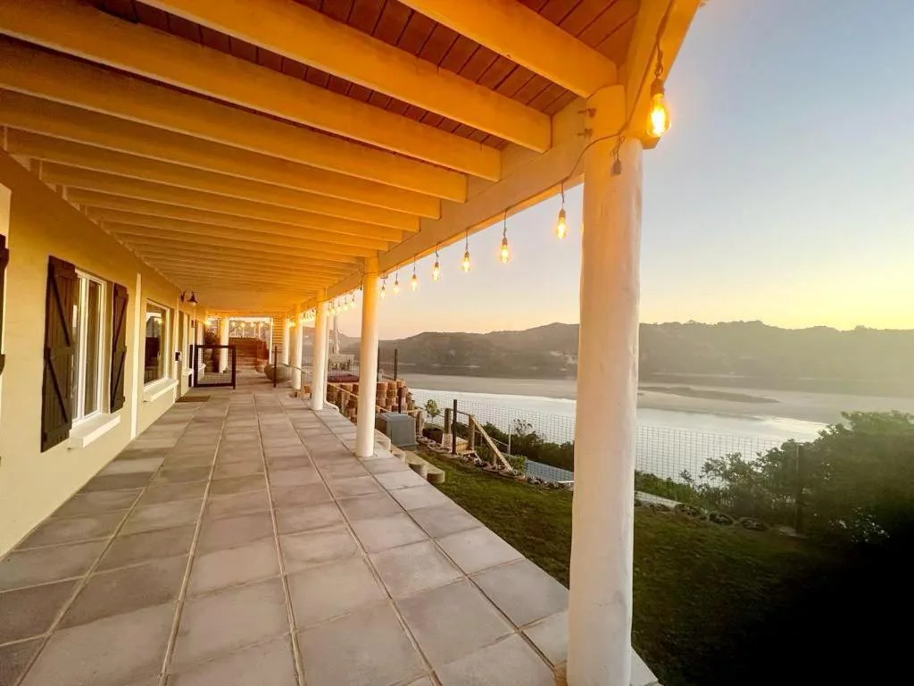 Covered patio with sunset views overlooking Sedgefield Lagoon and mountains