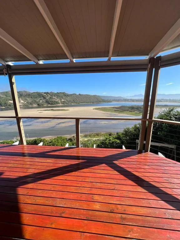 Covered wooden deck overlooking Sedgefield Lagoon with coastal views