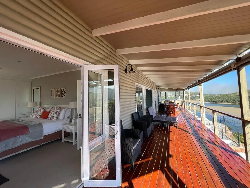 Spacious wraparound deck with lagoon views and outdoor seating areas
