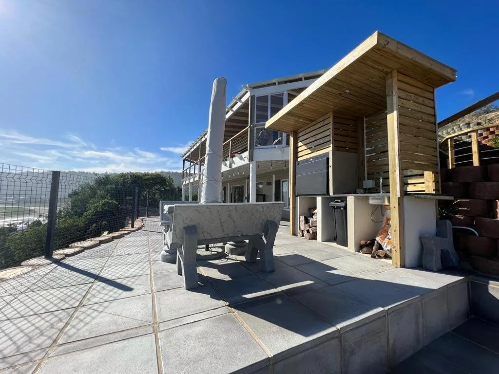 Spacious outdoor deck with built-in seating and contemporary wooden architecture