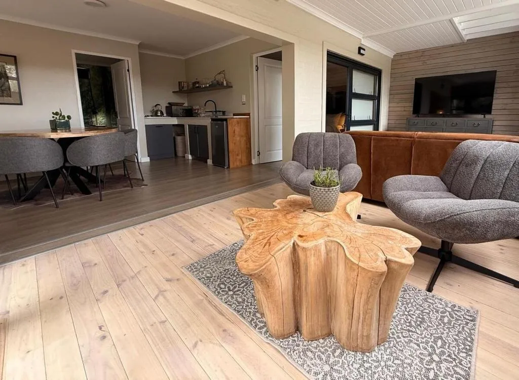 Open-plan lounge with modern furnishings and wood coffee table