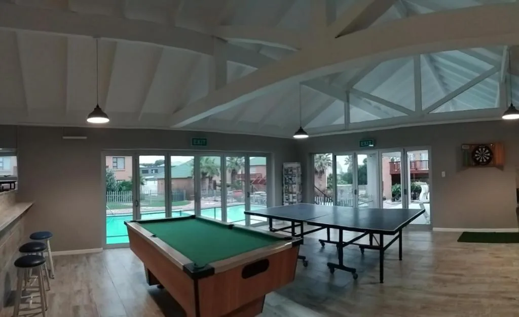 Games room with pool table, ping pong table, and pool views