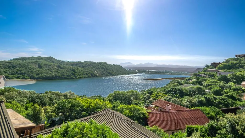 Scenic lagoon and mountain vista from elevated property vantage point