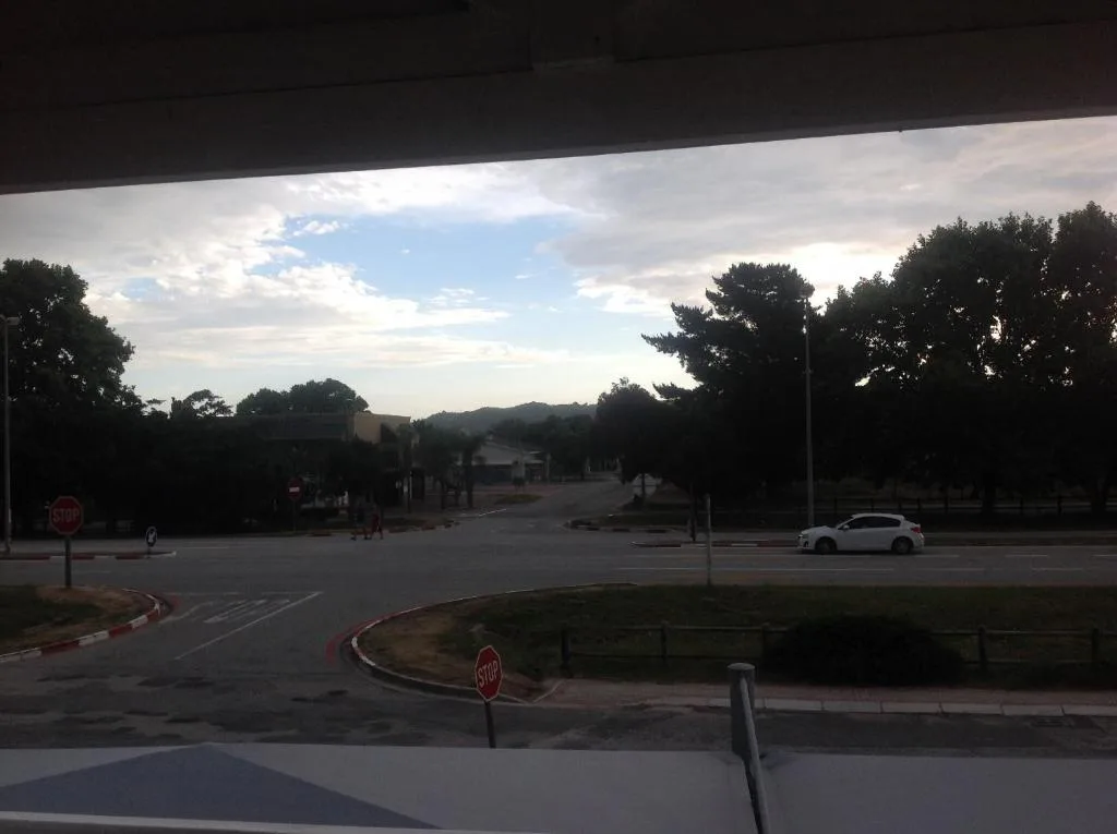 Scenic outlook from property overlooking tree-lined streets and mountains beyond
