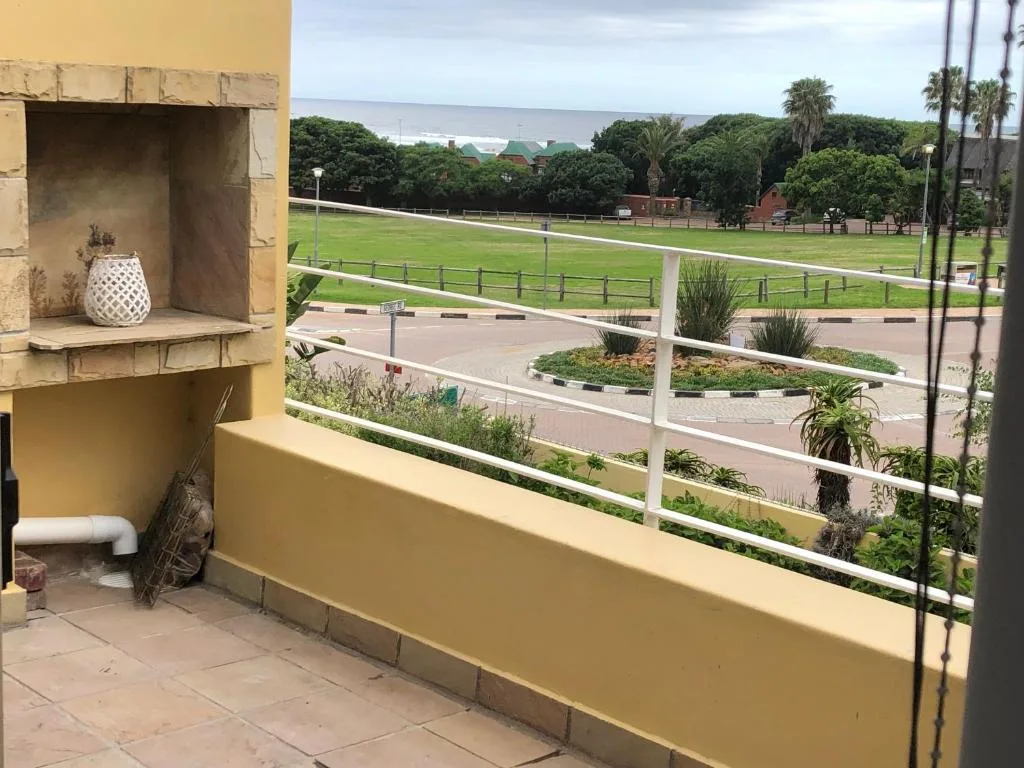 Scenic view of Wilderness lagoon and green fields from balcony