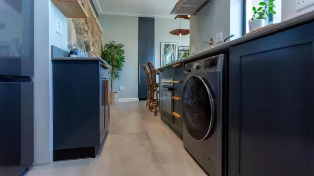 Modern laundry room with stainless steel washer and dryer appliances