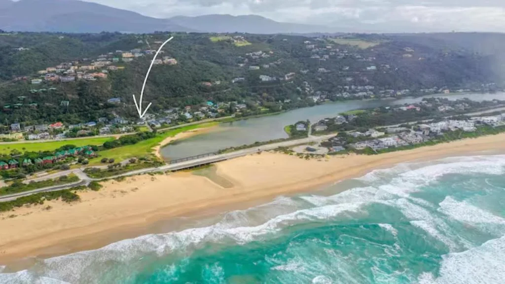 Aerial view of Wilderness beach, lagoon, and surrounding lush coastal landscape