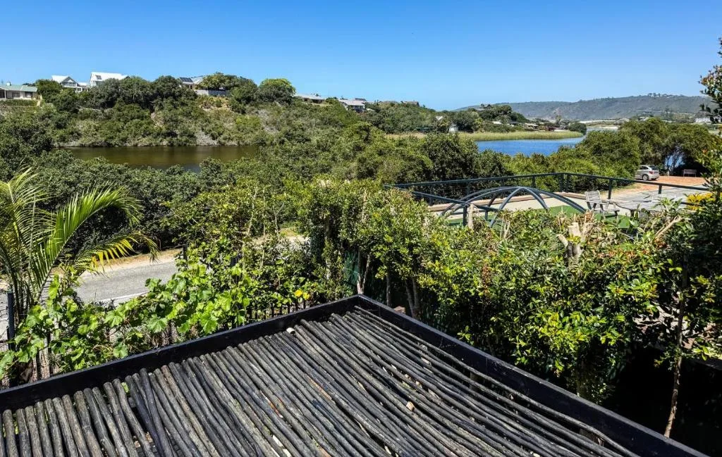 Scenic lagoon and lush vegetation view from elevated deck area