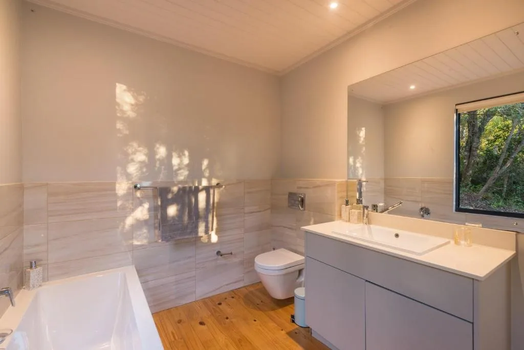Modern bathroom with walk-in shower, soaking tub, and double vanity