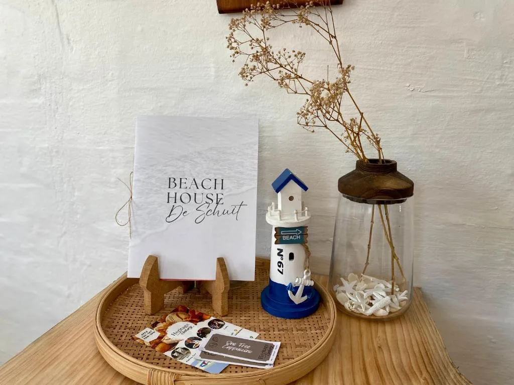 Coastal-themed welcome display with beach house signage and nautical decor