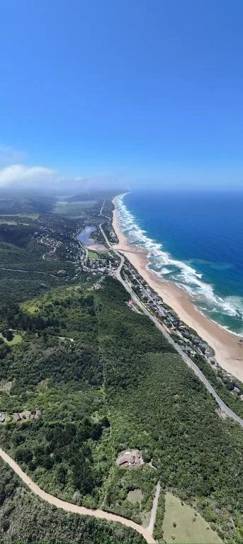 Aerial coastal view of Wilderness beach and forested landscape along Garden Route