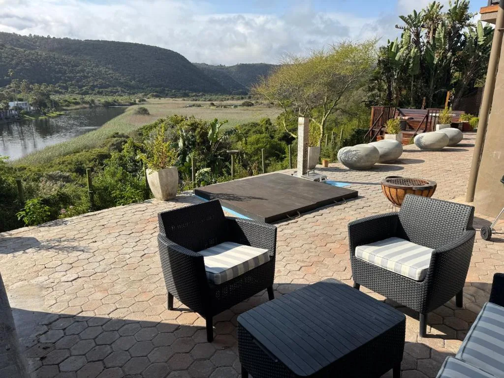 Spacious paved deck with seating overlooking lagoon and mountains