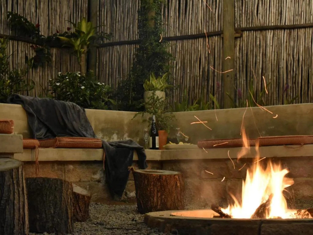 Outdoor seating area with fire pit and comfortable lounge furniture