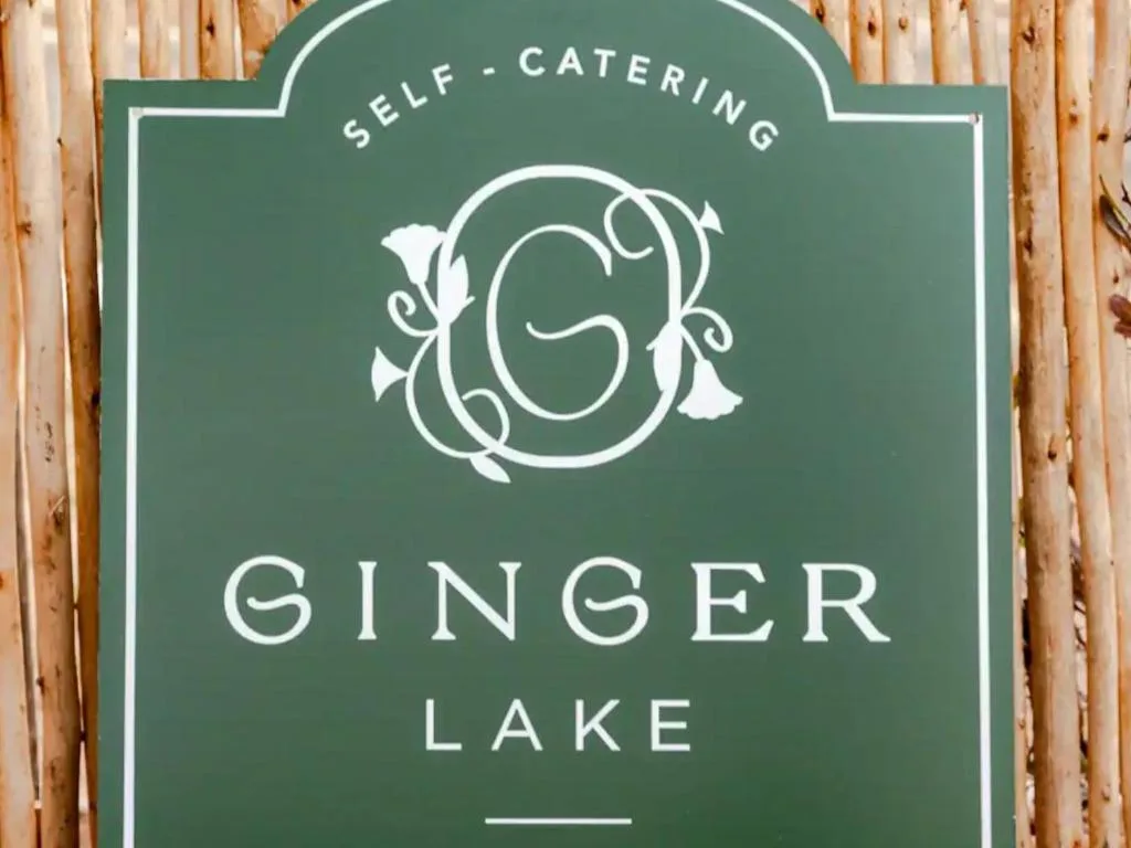 Green property sign for Ginger Lake self-catering accommodation in Wilderness