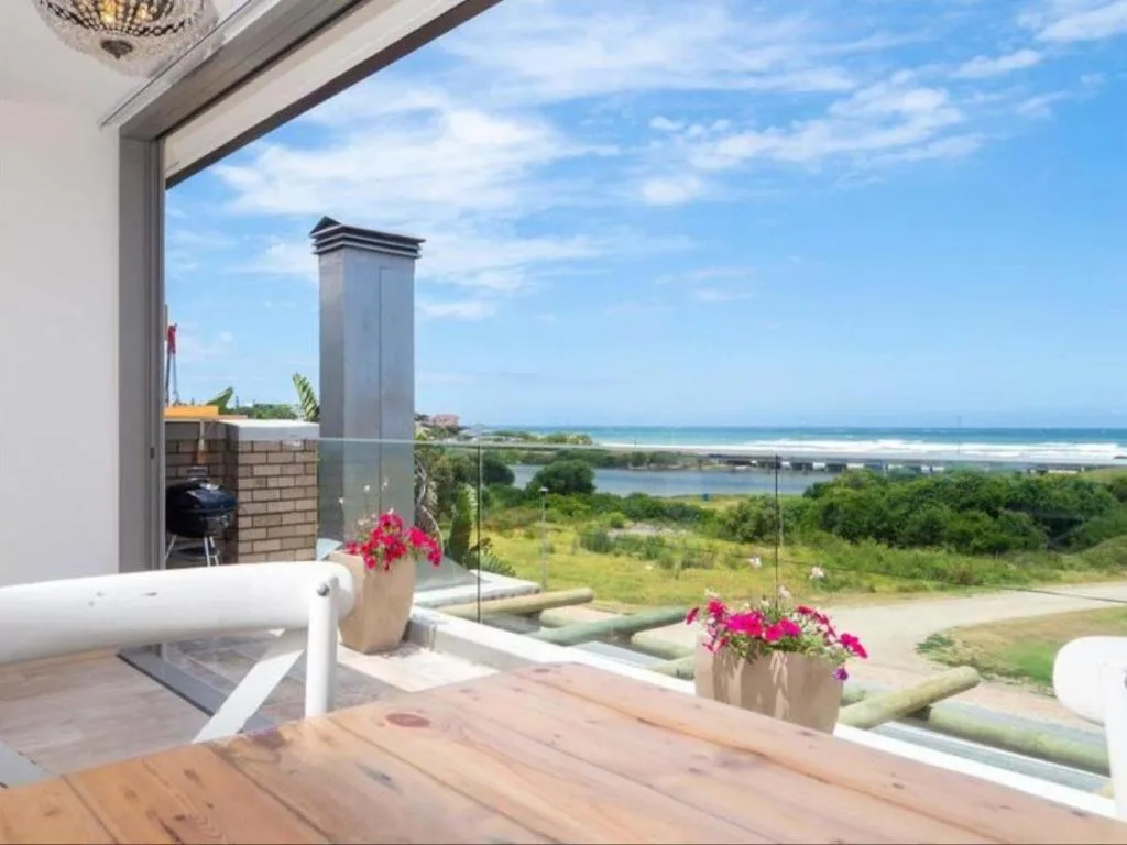Panoramic coastal view of Wilderness lagoon and beach from elevated deck