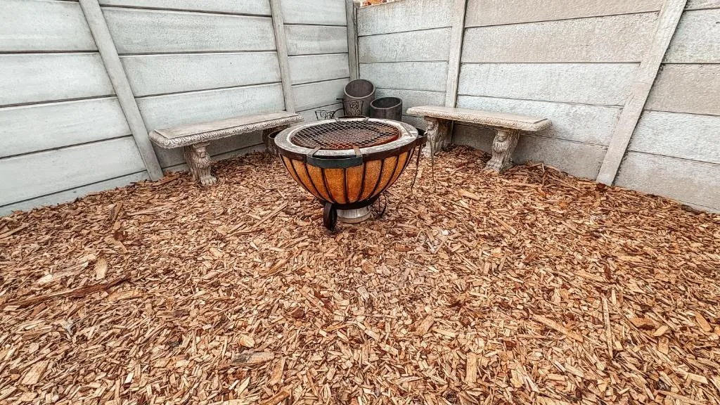 Outdoor seating area with fire pit and concrete bench seating