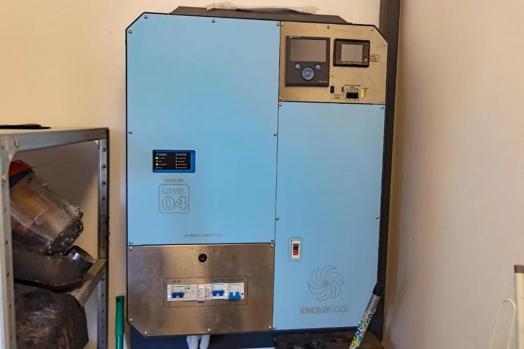 Solar power inverter and energy management system mounted on wall