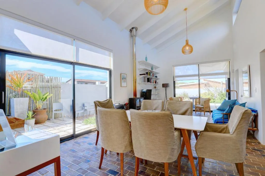 Bright open-plan living area with comfortable seating and ocean views