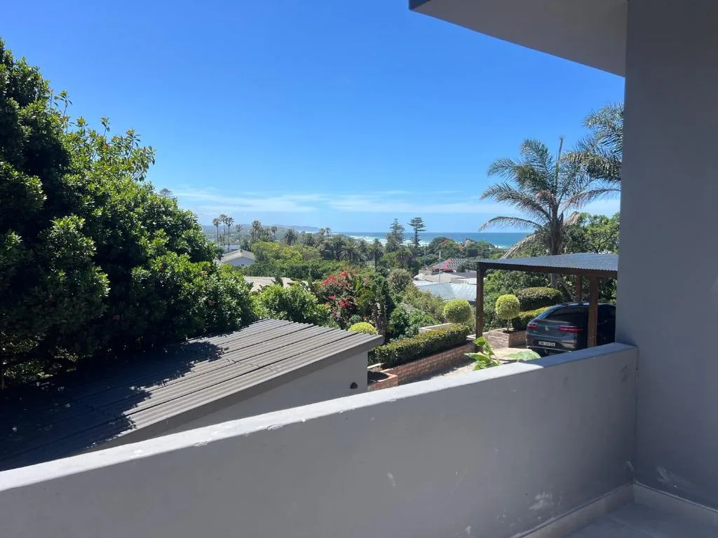 Ocean and mountain vista from elevated property balcony overlooking Wilderness