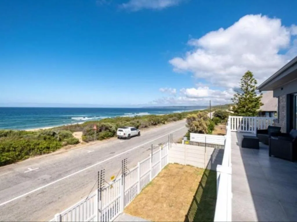 Panoramic ocean and coastal landscape view from property deck
