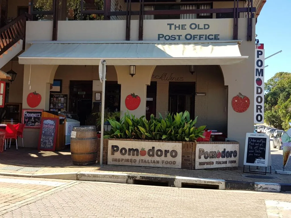 Historic Old Post Office building facade with Pomodoro restaurant storefront